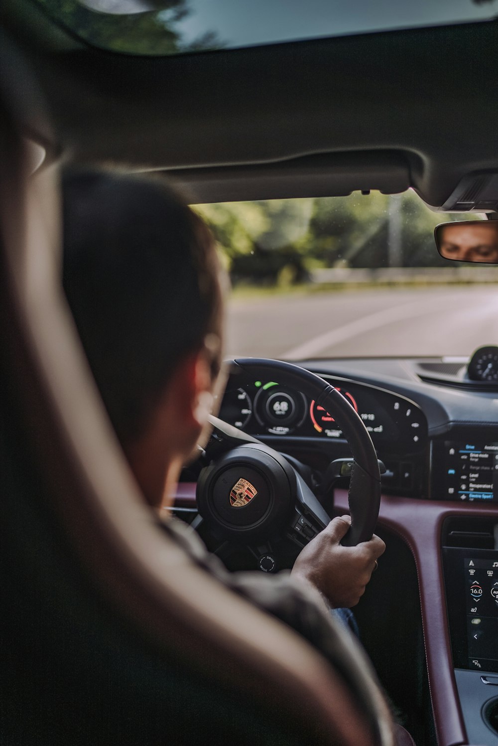 man driving car during daytime