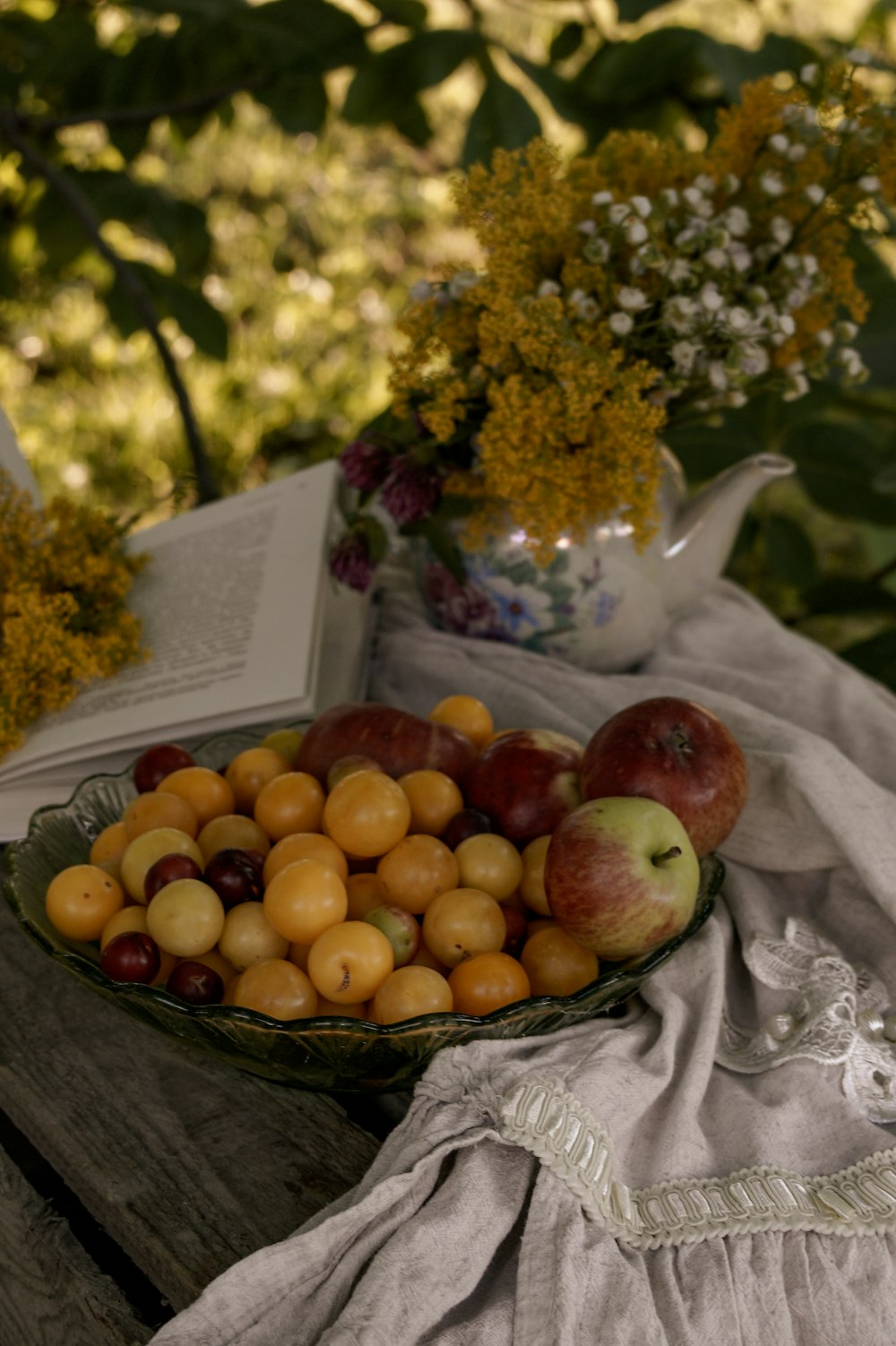 red apples on clear glass bowl