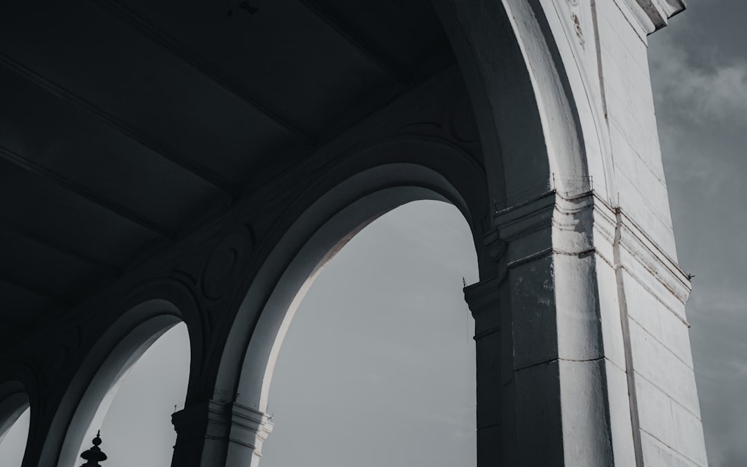 white concrete arch during daytime