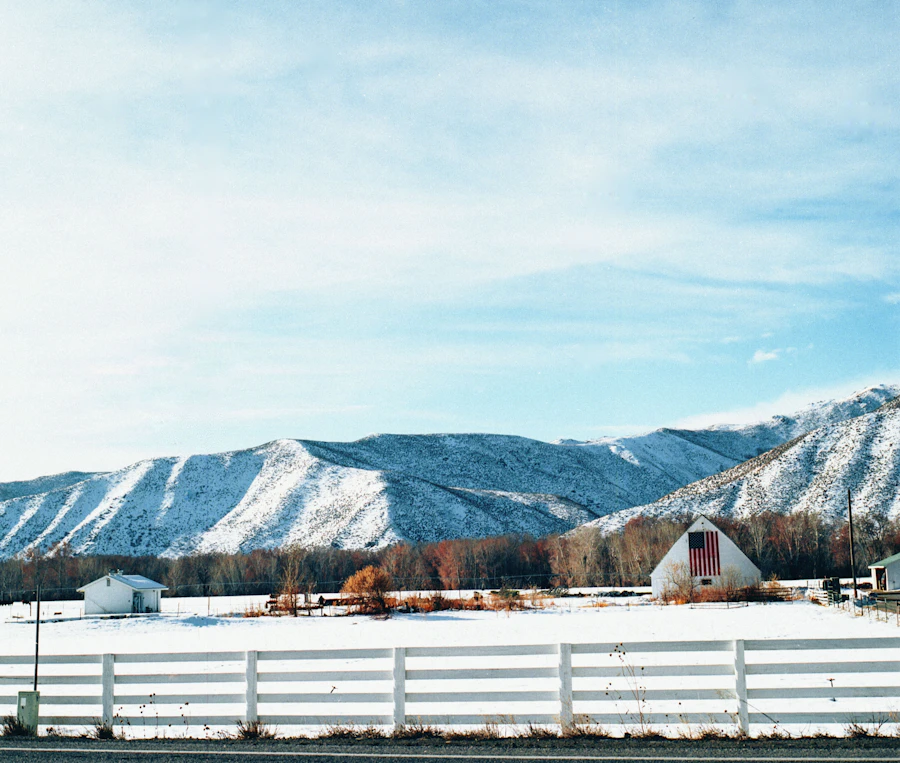 White fence near a mountain