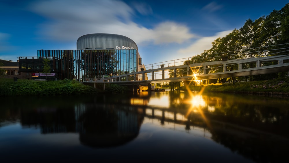 gray concrete building near green trees and river during night time