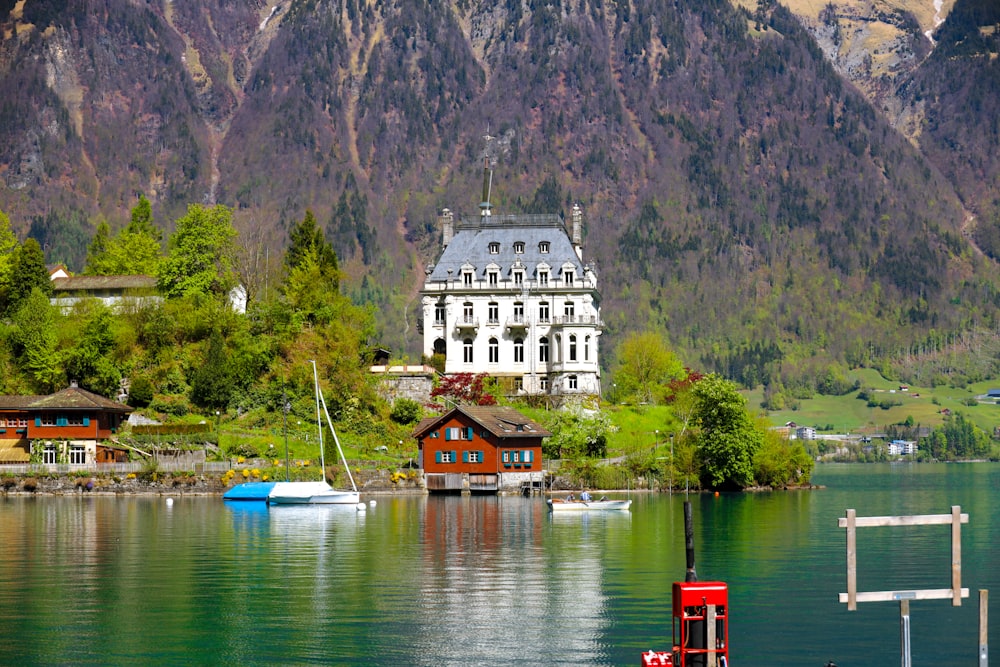 white and brown concrete building near body of water during daytime