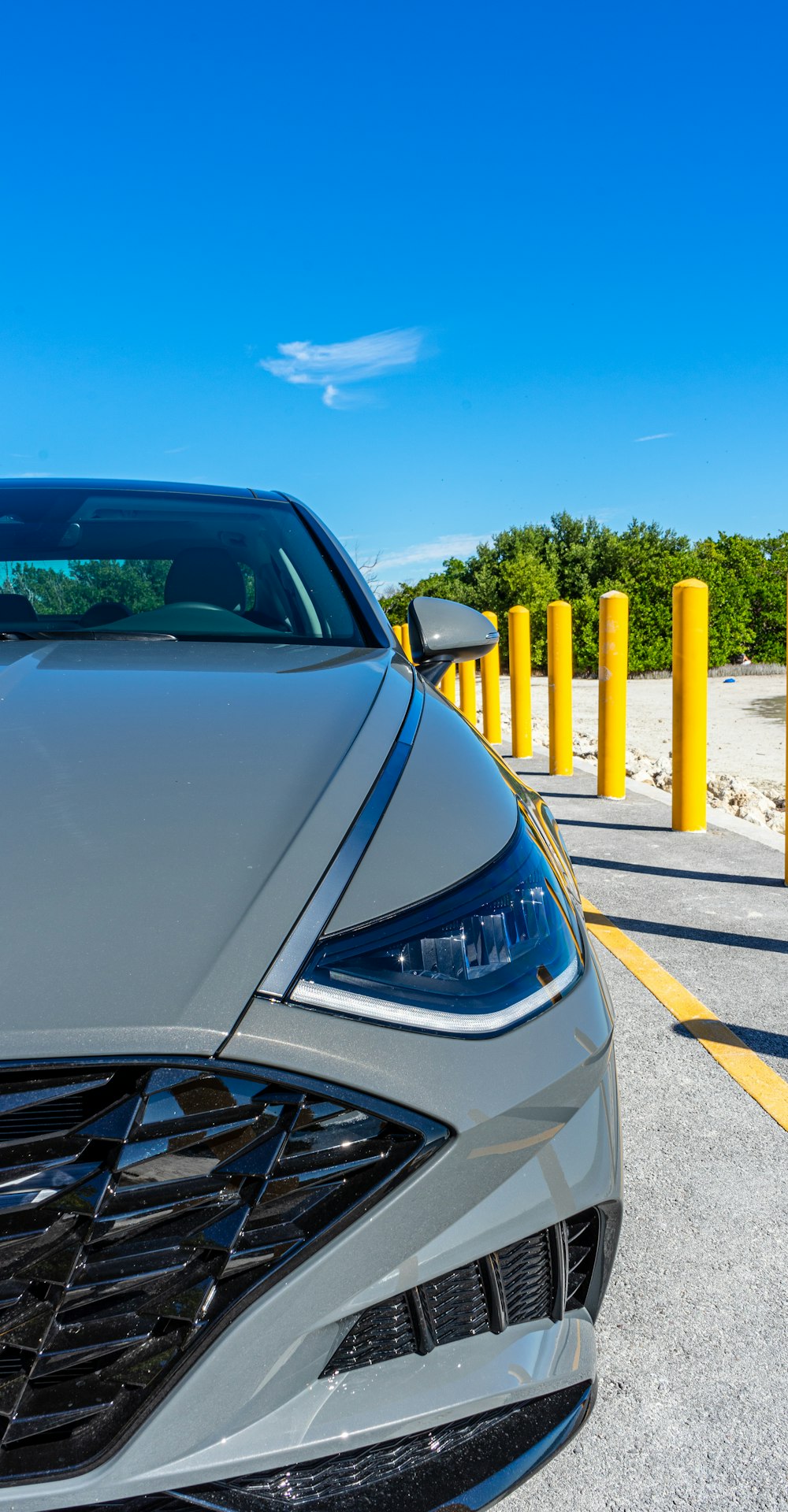 grey car parked on side of the road during daytime