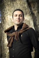 woman in black long sleeve shirt and brown scarf