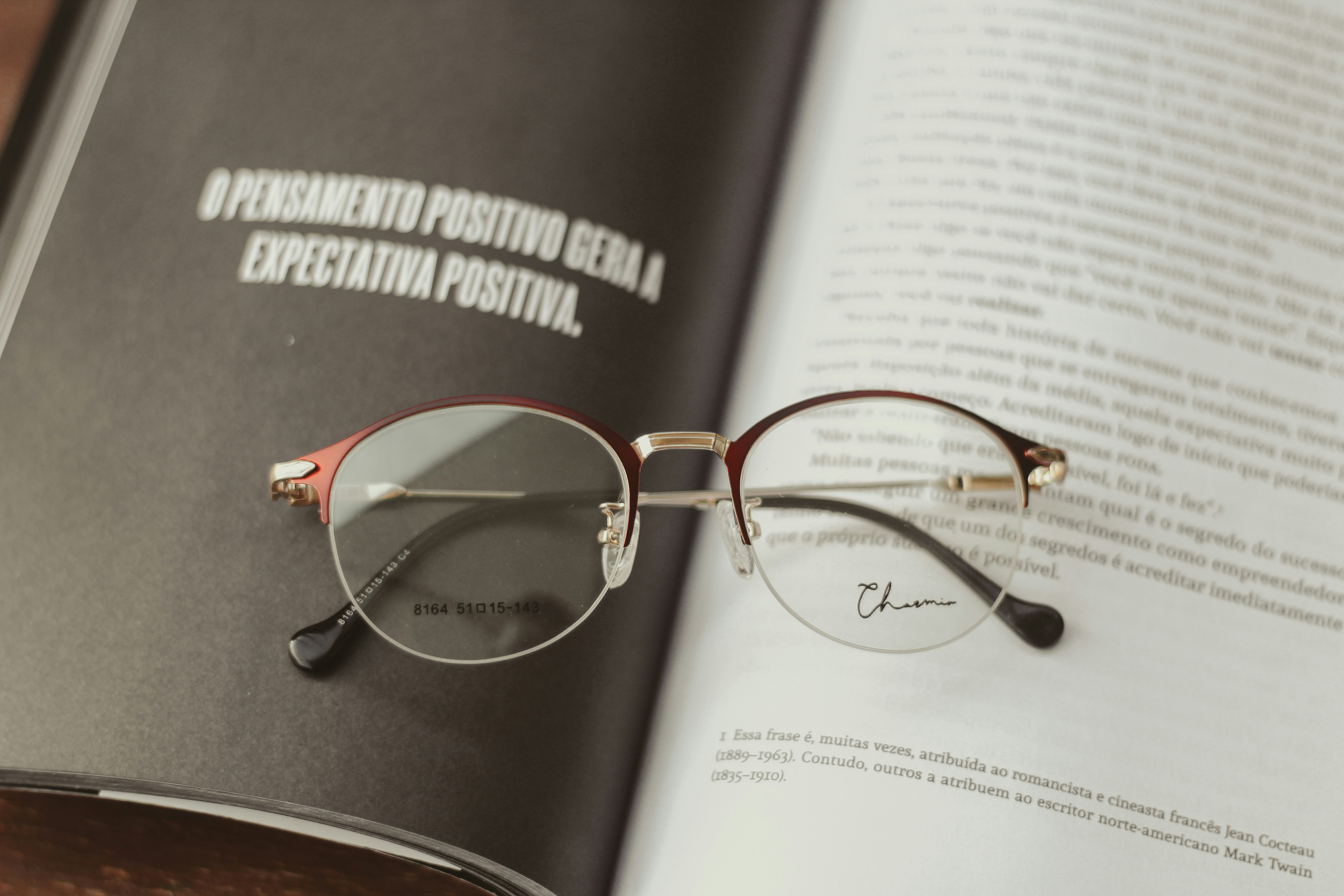 A magnifying glass over documents, symbolizing detailed analysis and precision in a professional context.