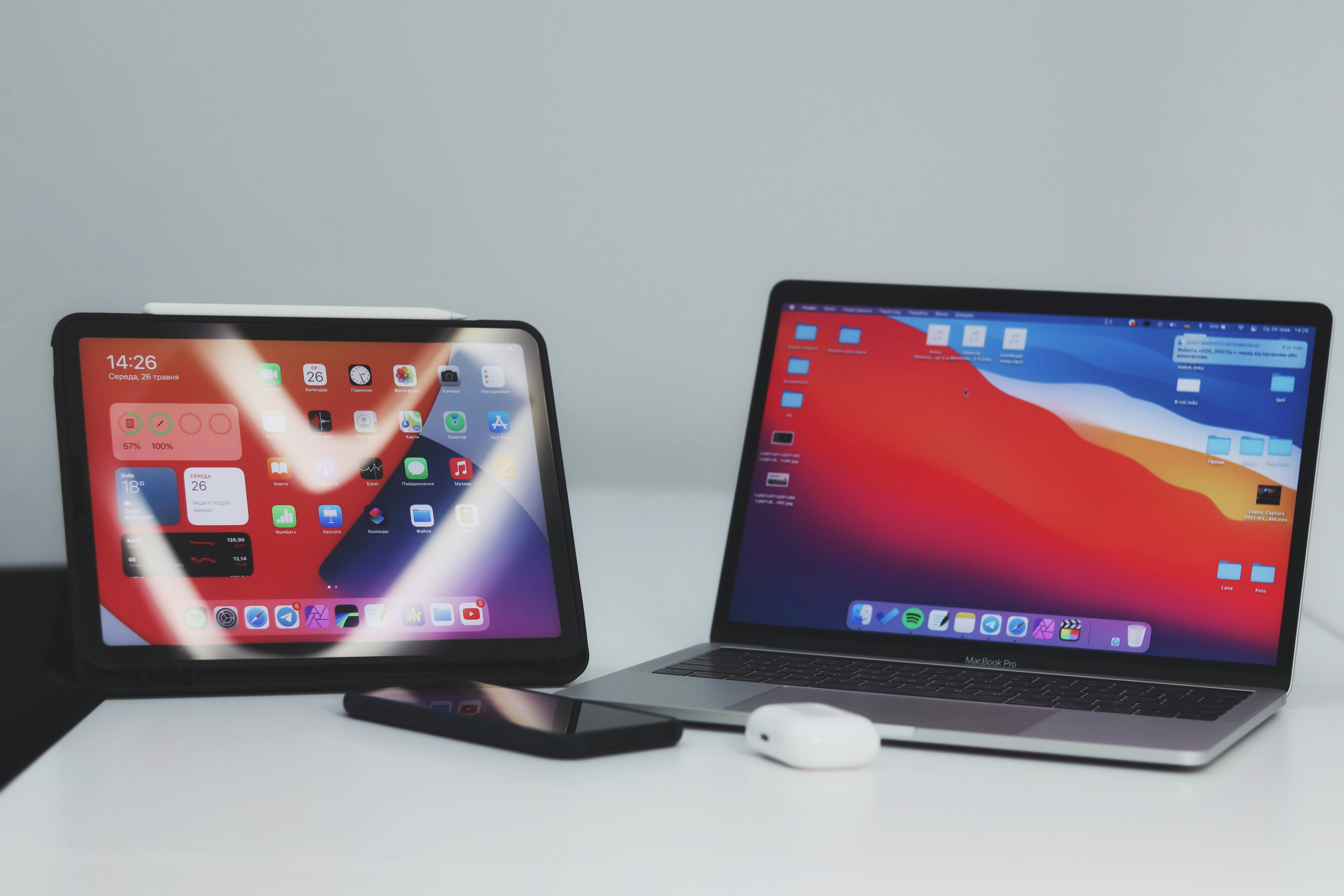 black ipad beside black ipad