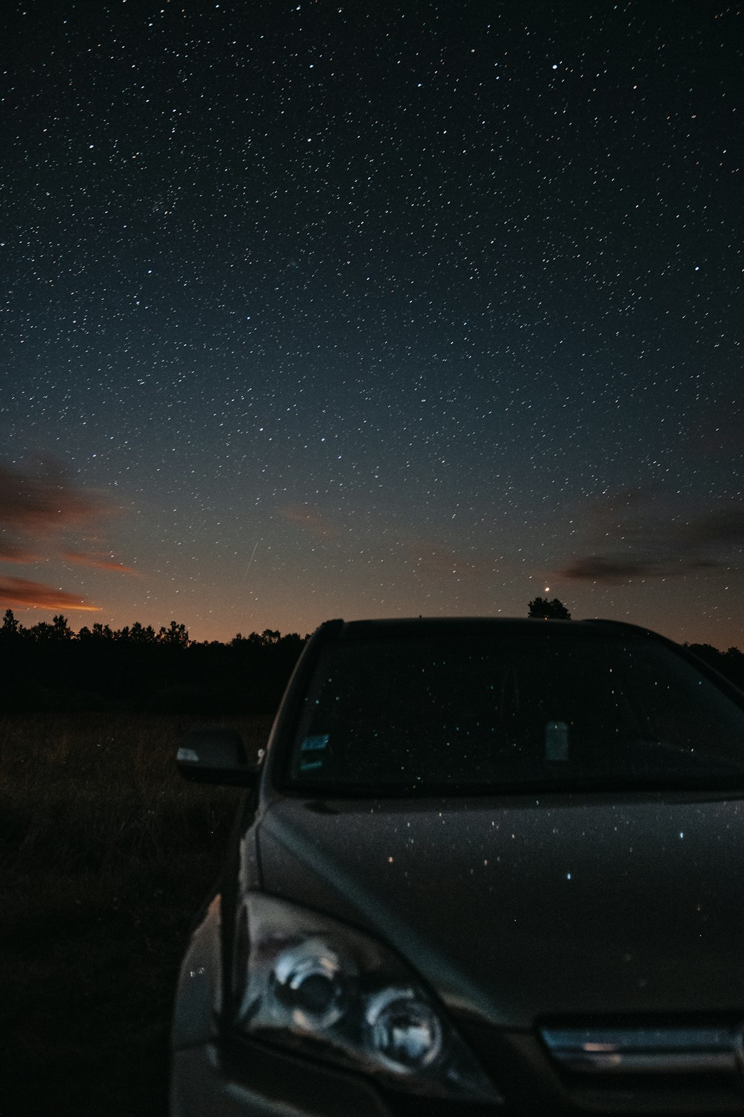 gray car on road during night time