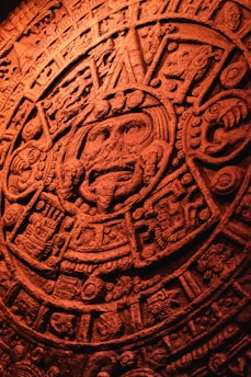 Ancient Aztec calendar stone with intricate carvings