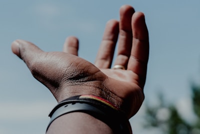 person wearing black and white watch