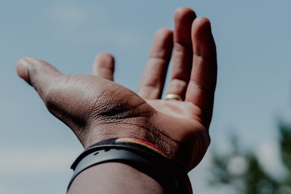 person wearing black and white watch