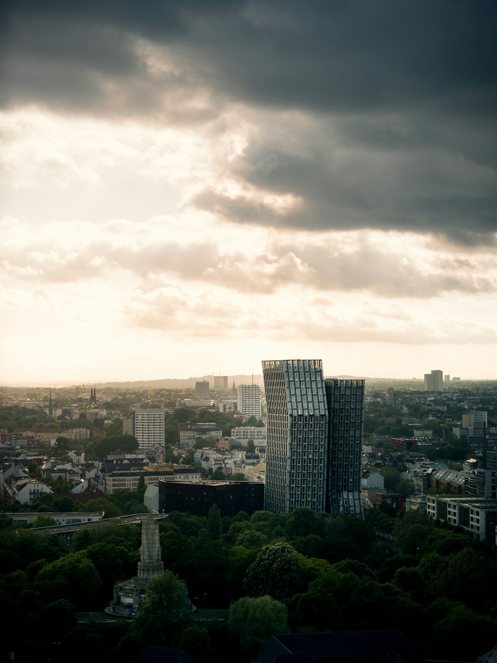 city buildings under cloudy sky during daytime