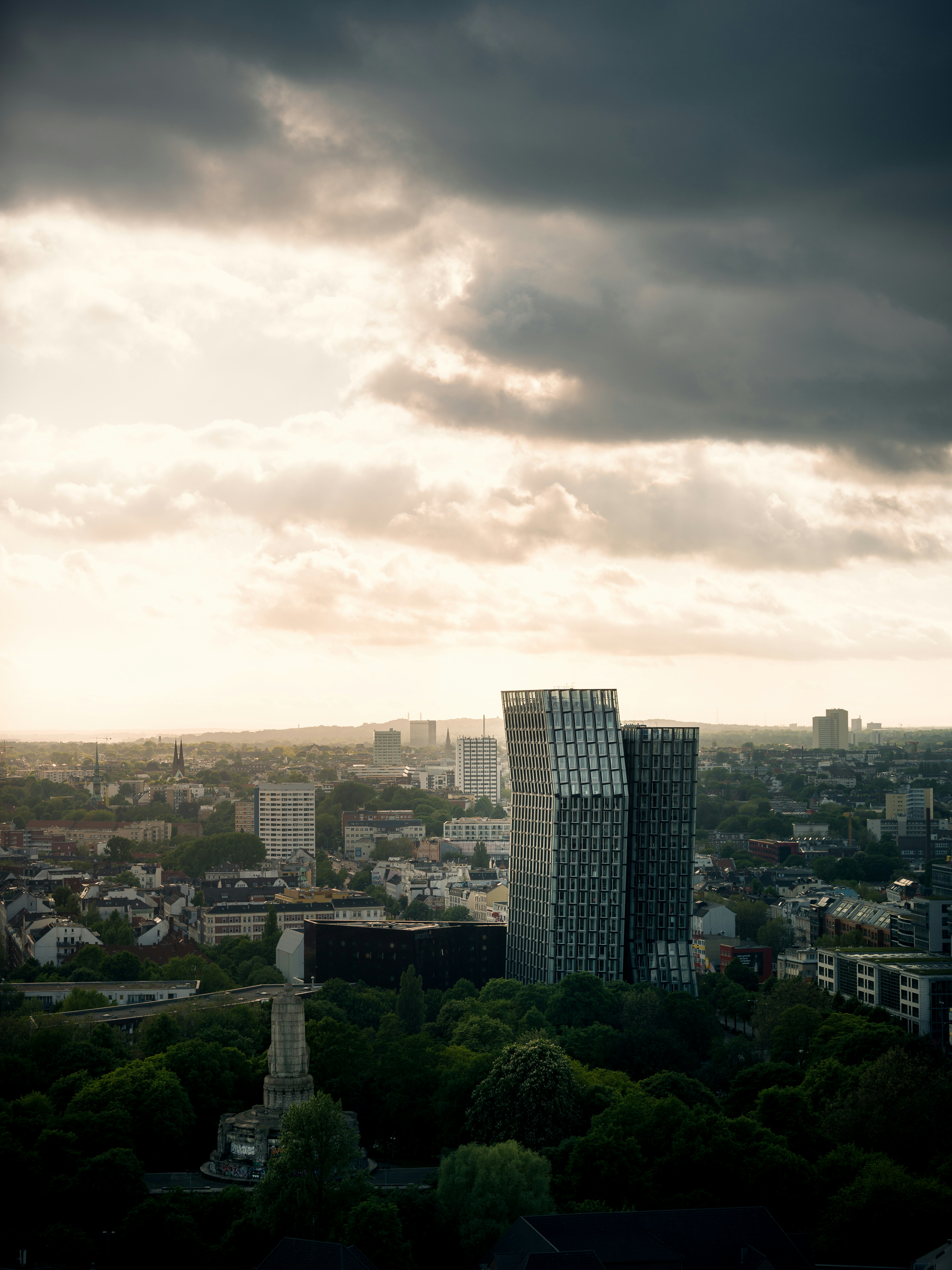 city buildings under cloudy sky during daytime