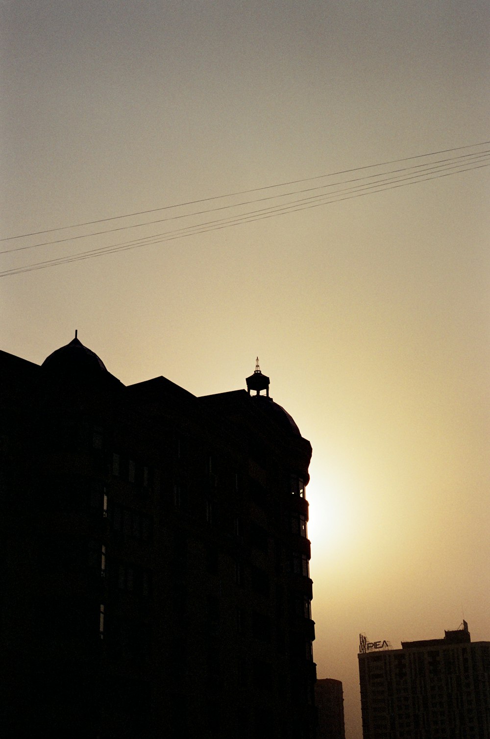 silhouette of building during sunset