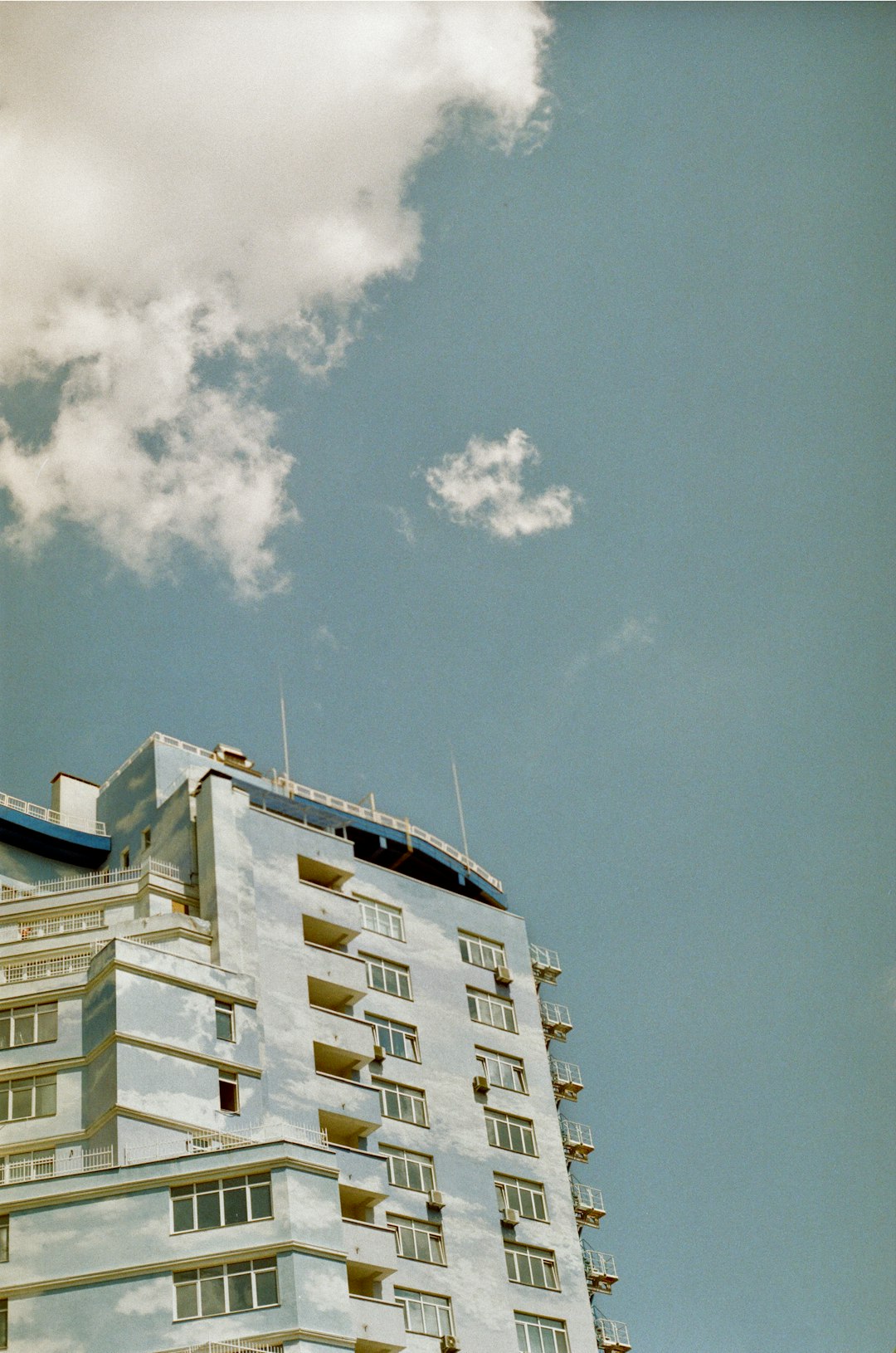 white concrete building under blue sky during daytime