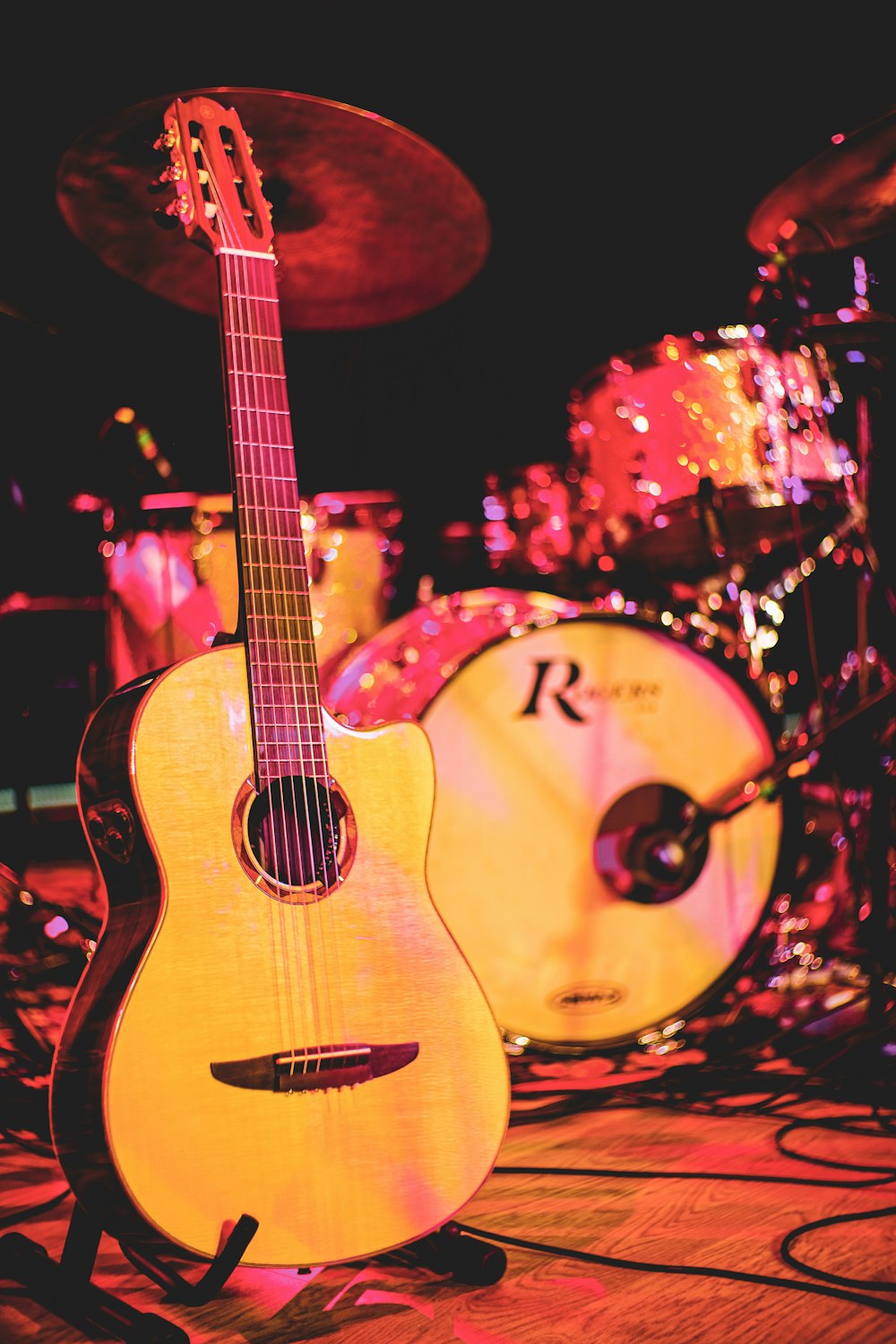 brown acoustic guitar on black background