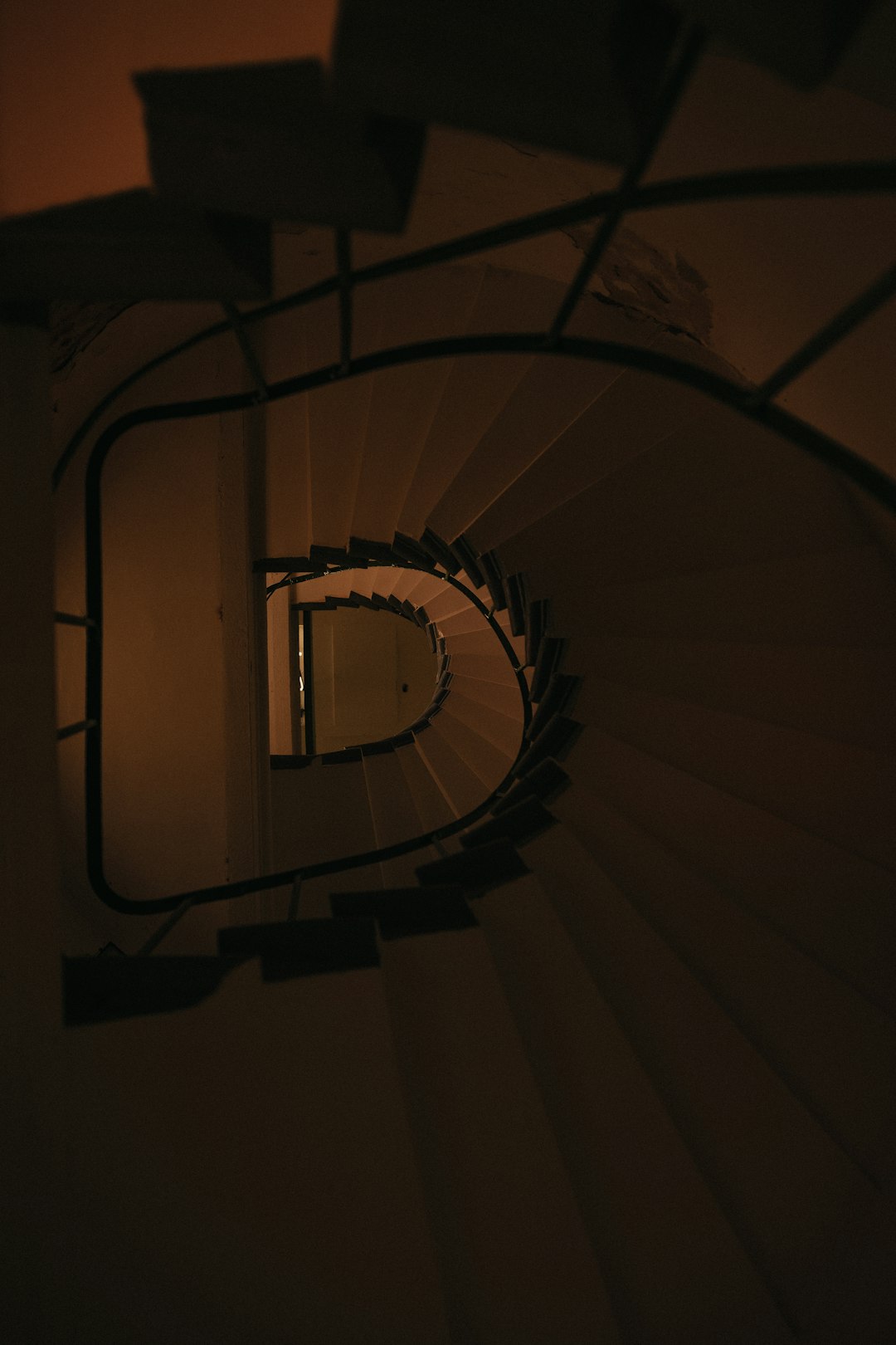 brown spiral staircase with white light