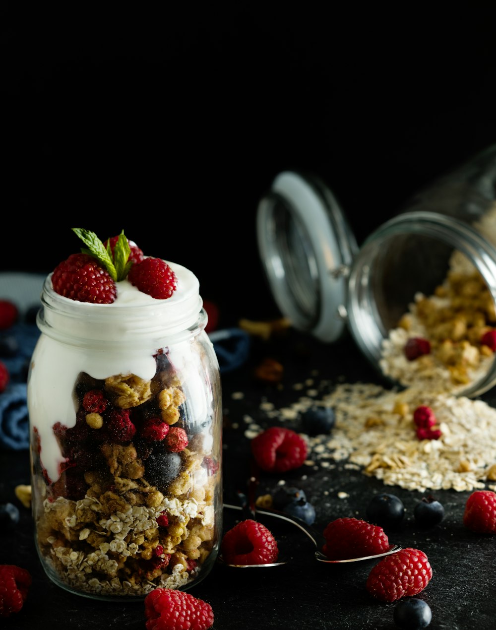 red strawberries in clear glass jar