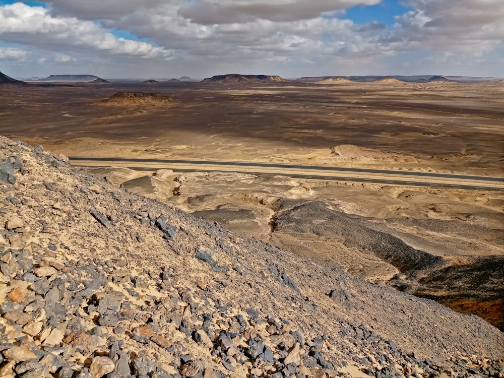 brown and gray rocky mountain under white cloudy sky during daytime