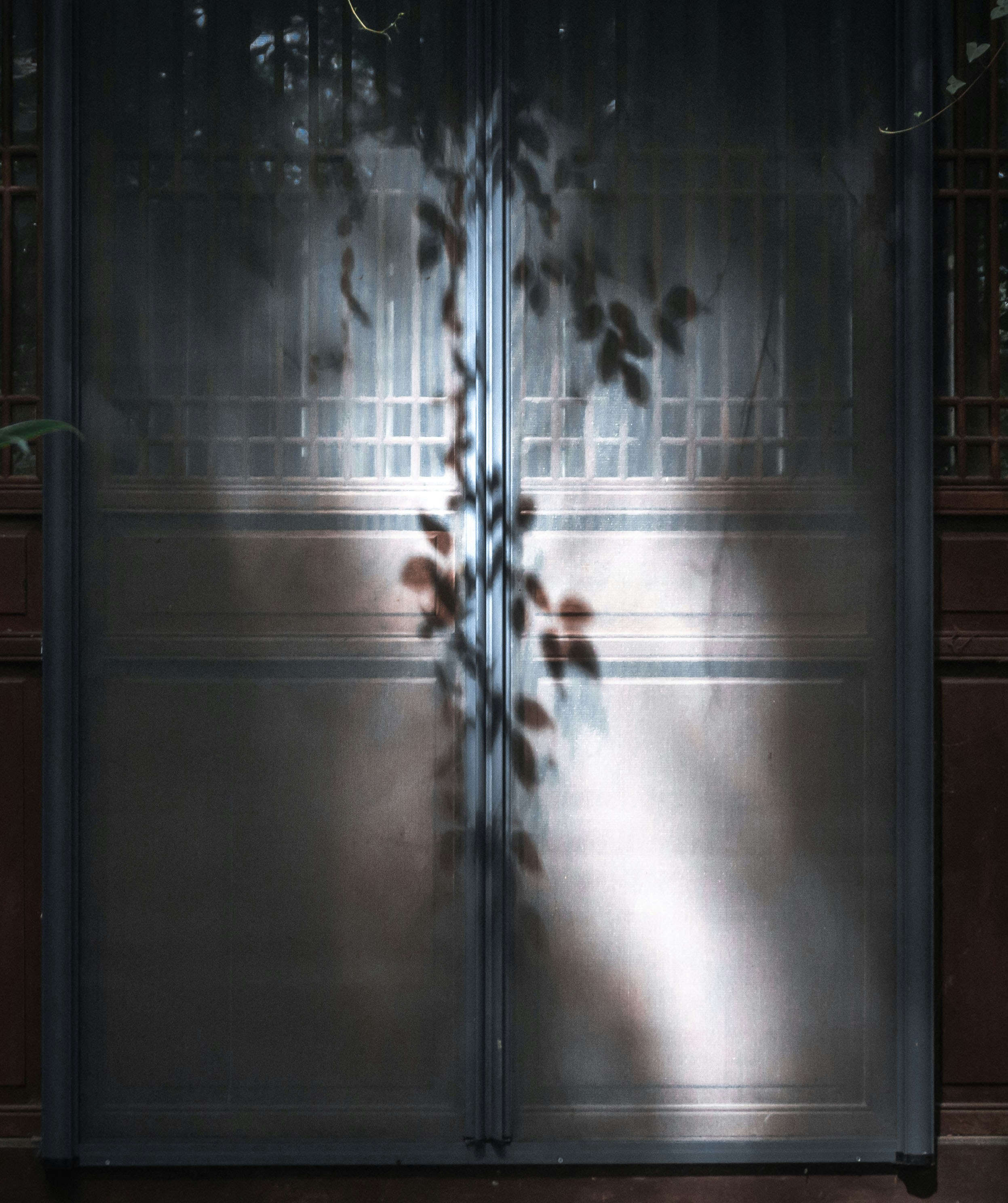 black wooden framed glass door