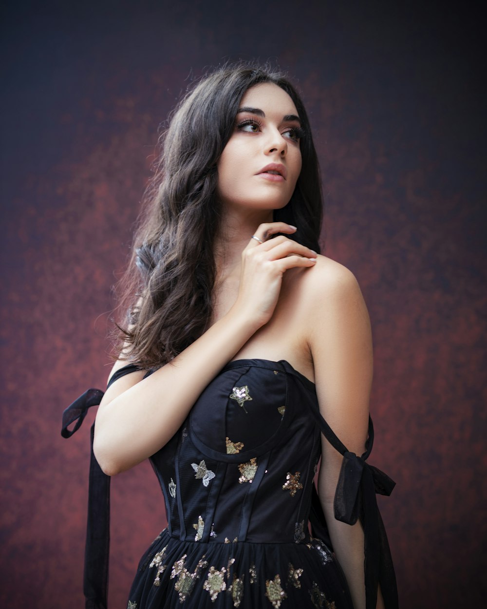 woman in black and white floral dress