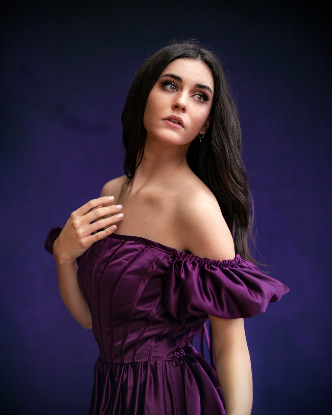 woman in purple off shoulder dress