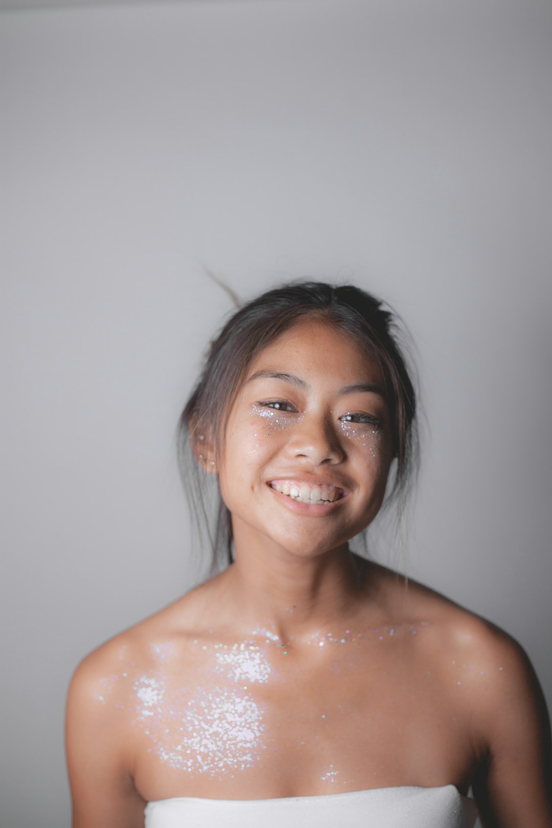 smiling woman with silver earrings