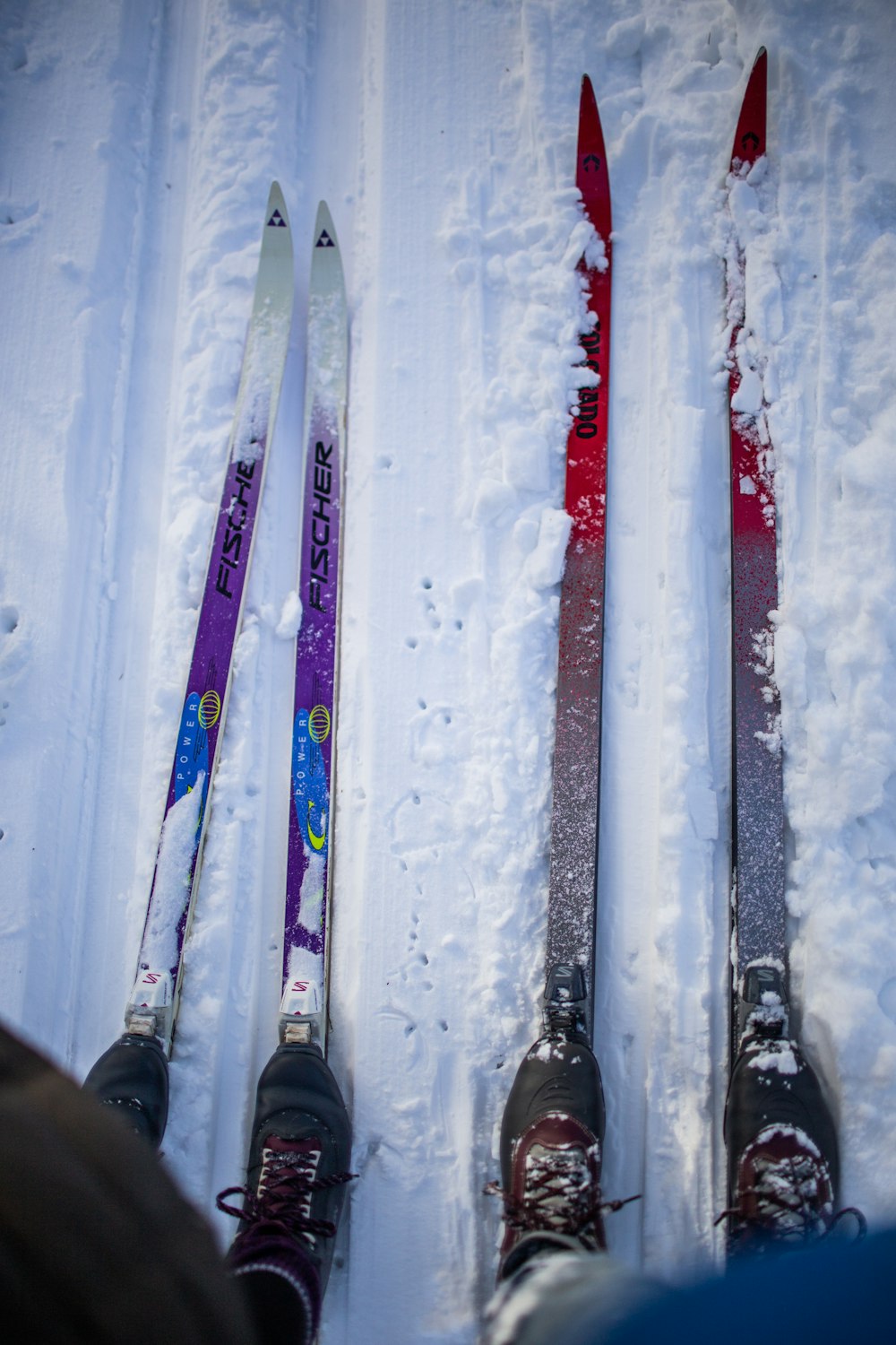 white and red ski blades on snow
