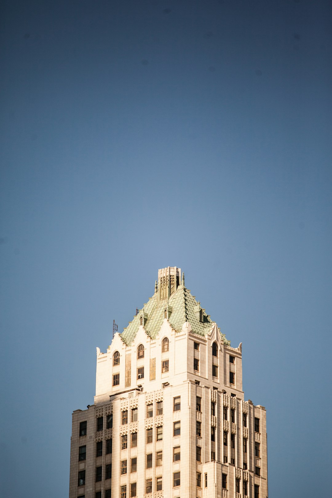 white concrete building under blue sky during daytime