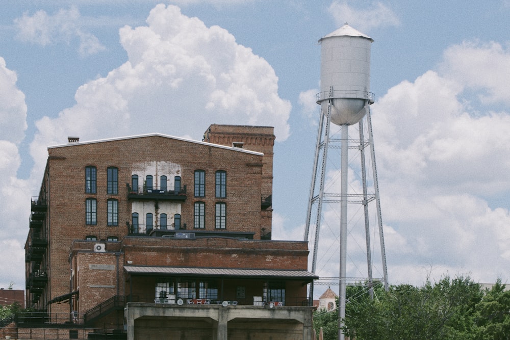 brown concrete building under white clouds during daytime