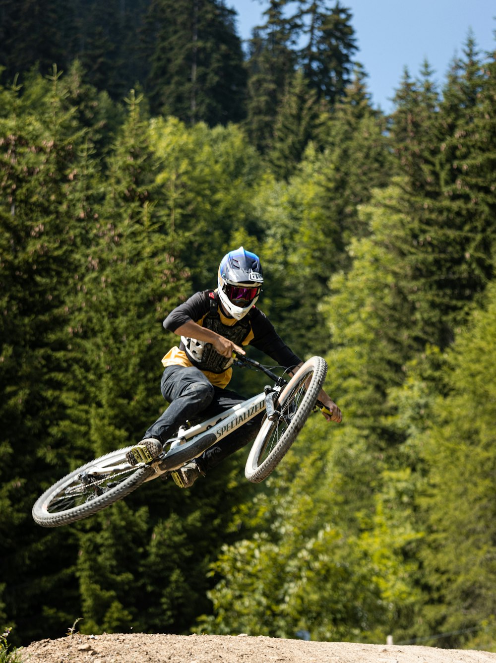 man in black jacket riding on motocross dirt bike