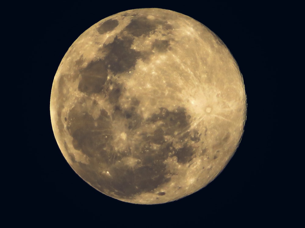 yellow moon with black background