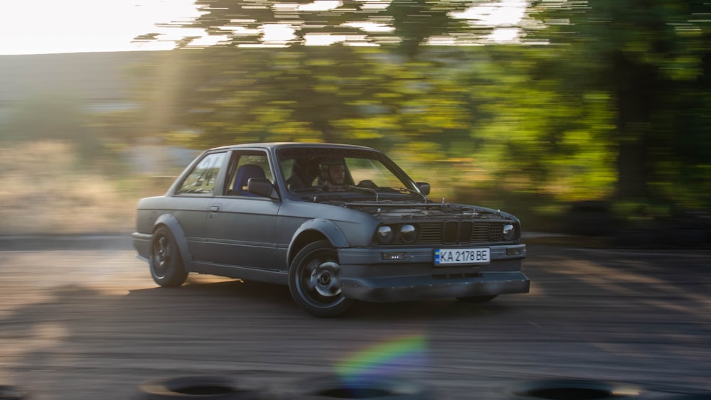 blue bmw m 3 on road during daytime