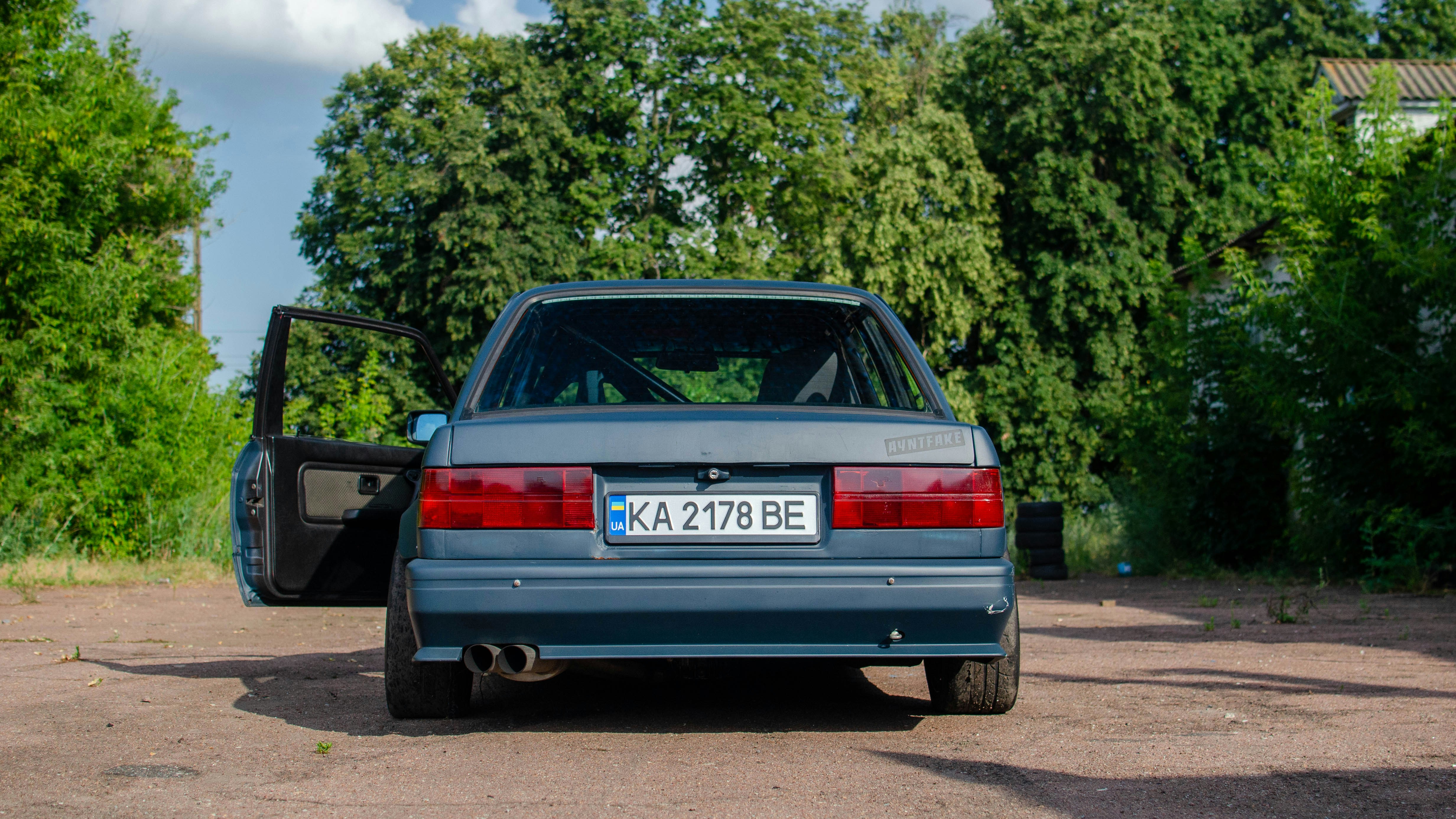 black audi a 4 parked on the side of the road