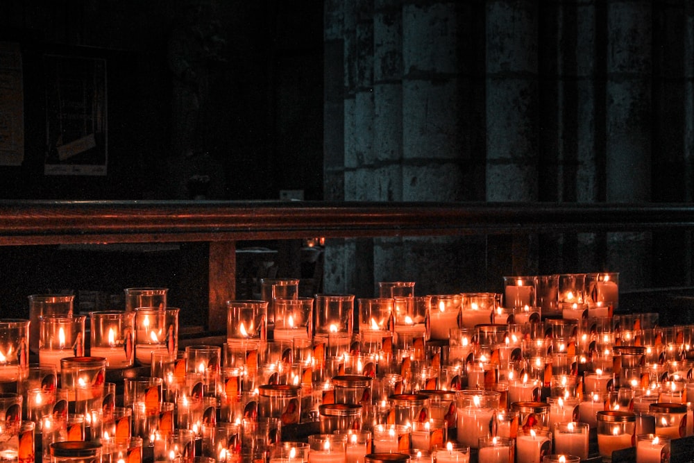 lighted candles on brown wooden table