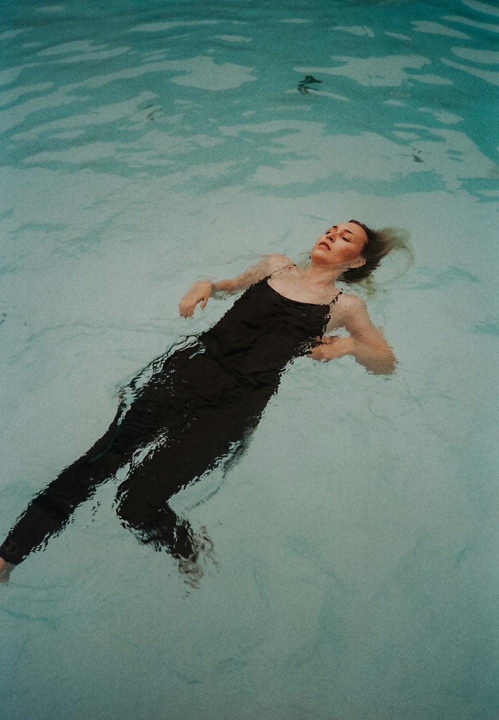 woman in black tube dress in water