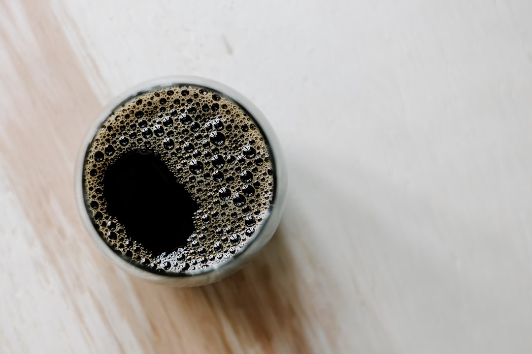 black beads in round silver container