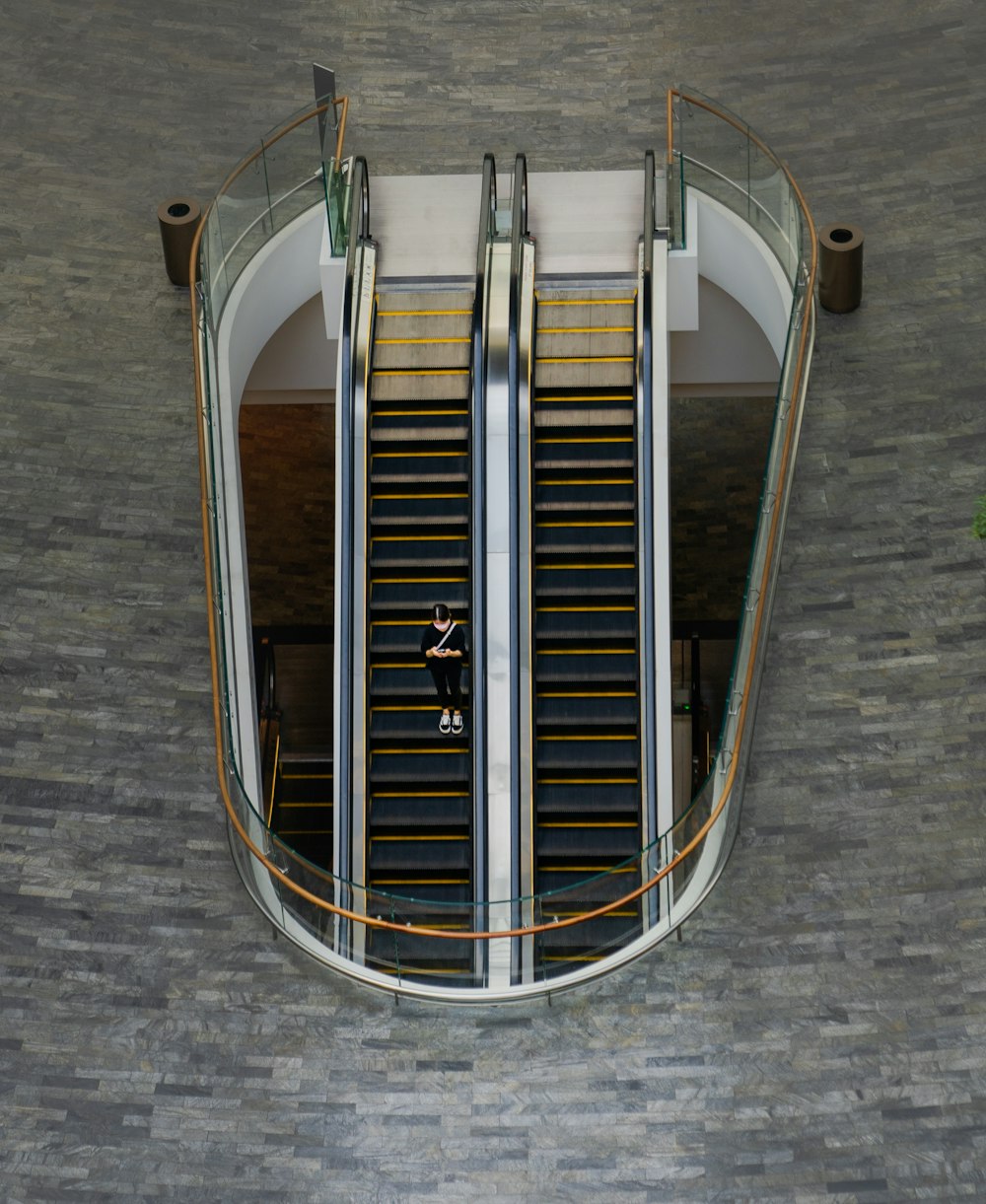stainless steel and brown escalator