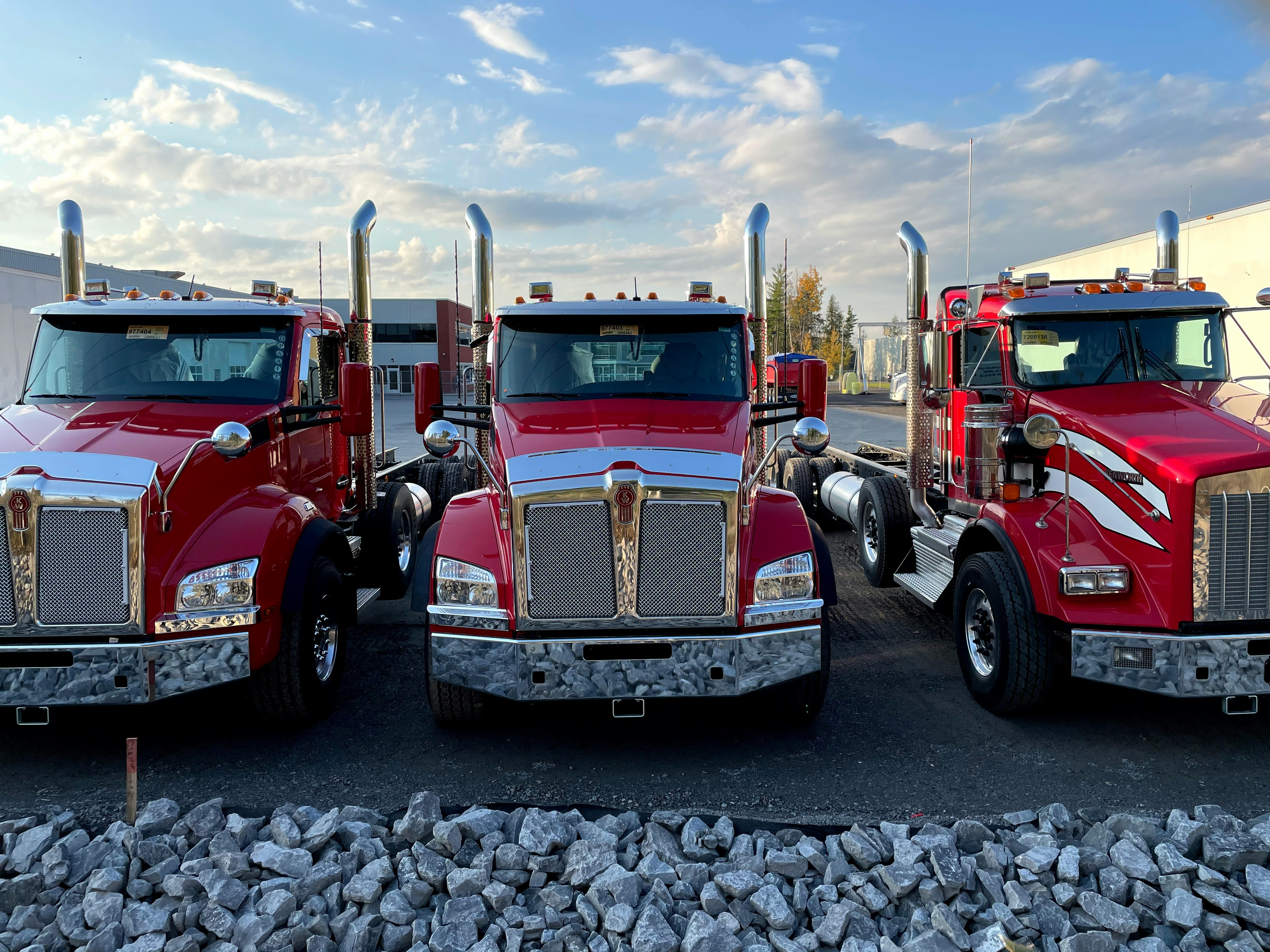 red and white truck on gray concrete pavement during daytime