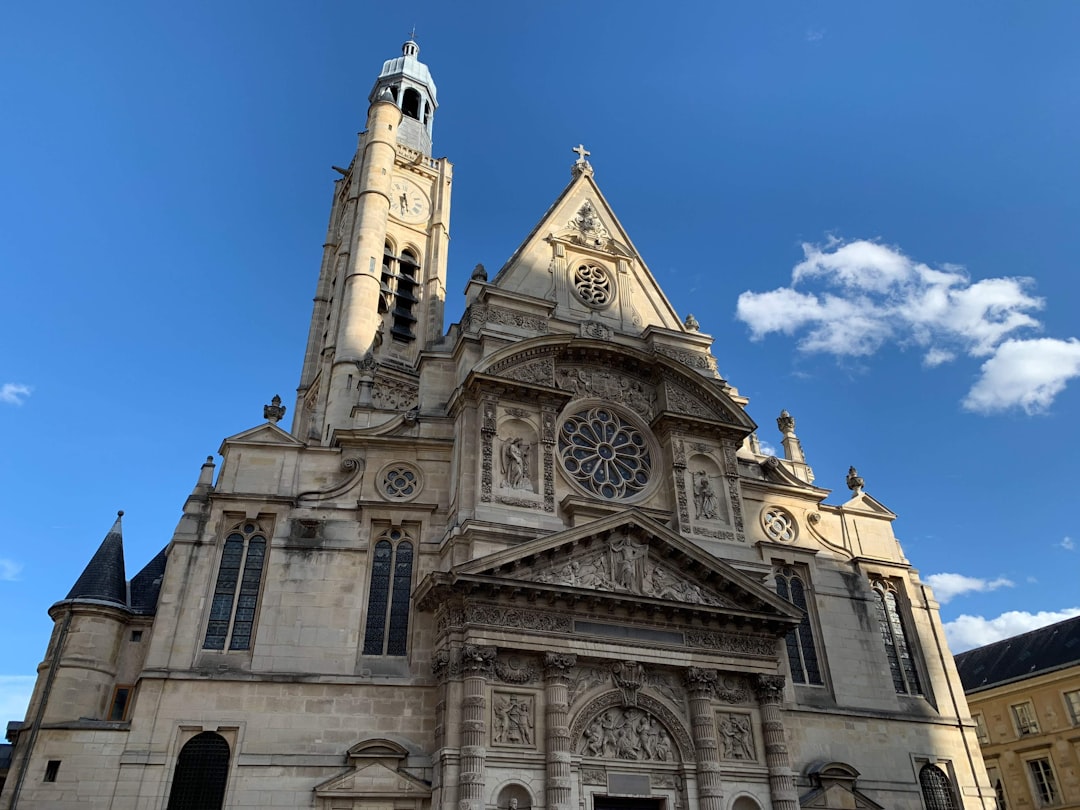 beige concrete church under blue sky during daytime