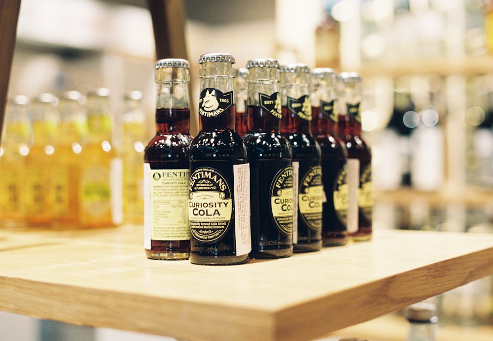 brown glass bottles on brown wooden table