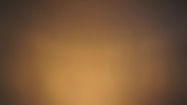 Elegant bathroom furniture in warm, earthy colors with subtle lighting.