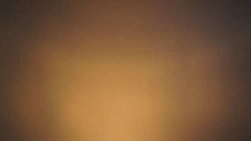 Elegant bathroom with warm tones and ambient lighting.