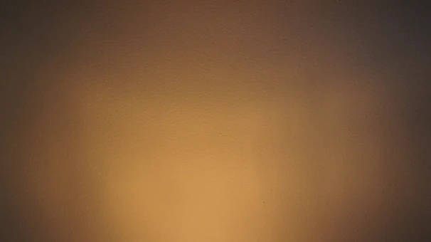 Interior wall finished with smooth facing materials in natural beige hues.