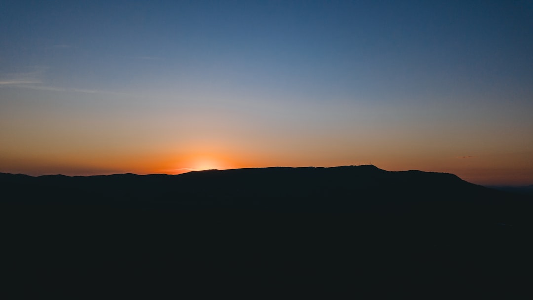 silhouette of mountain during sunset