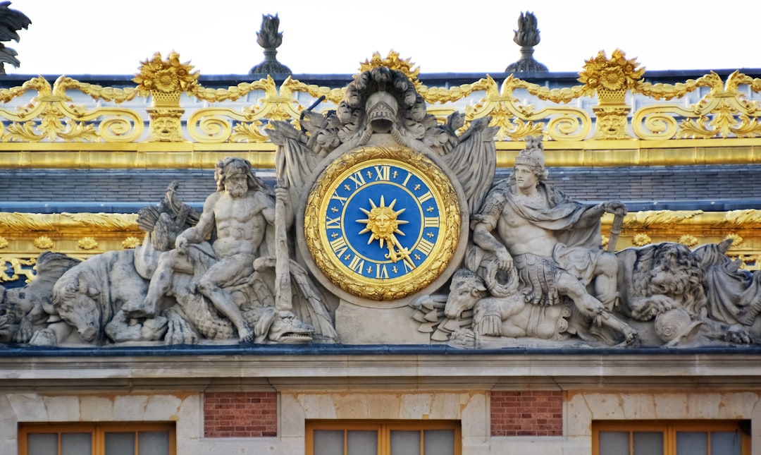 white and blue concrete building with lion and lion statues