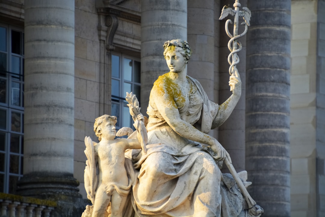 woman holding a baby statue