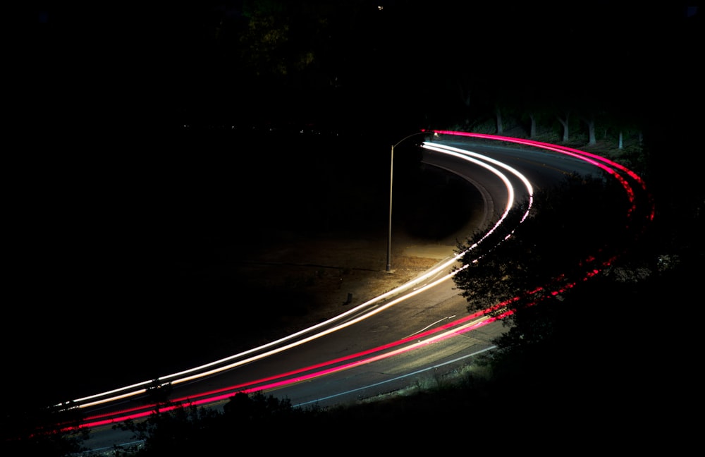 time lapse photography of cars on road during night time