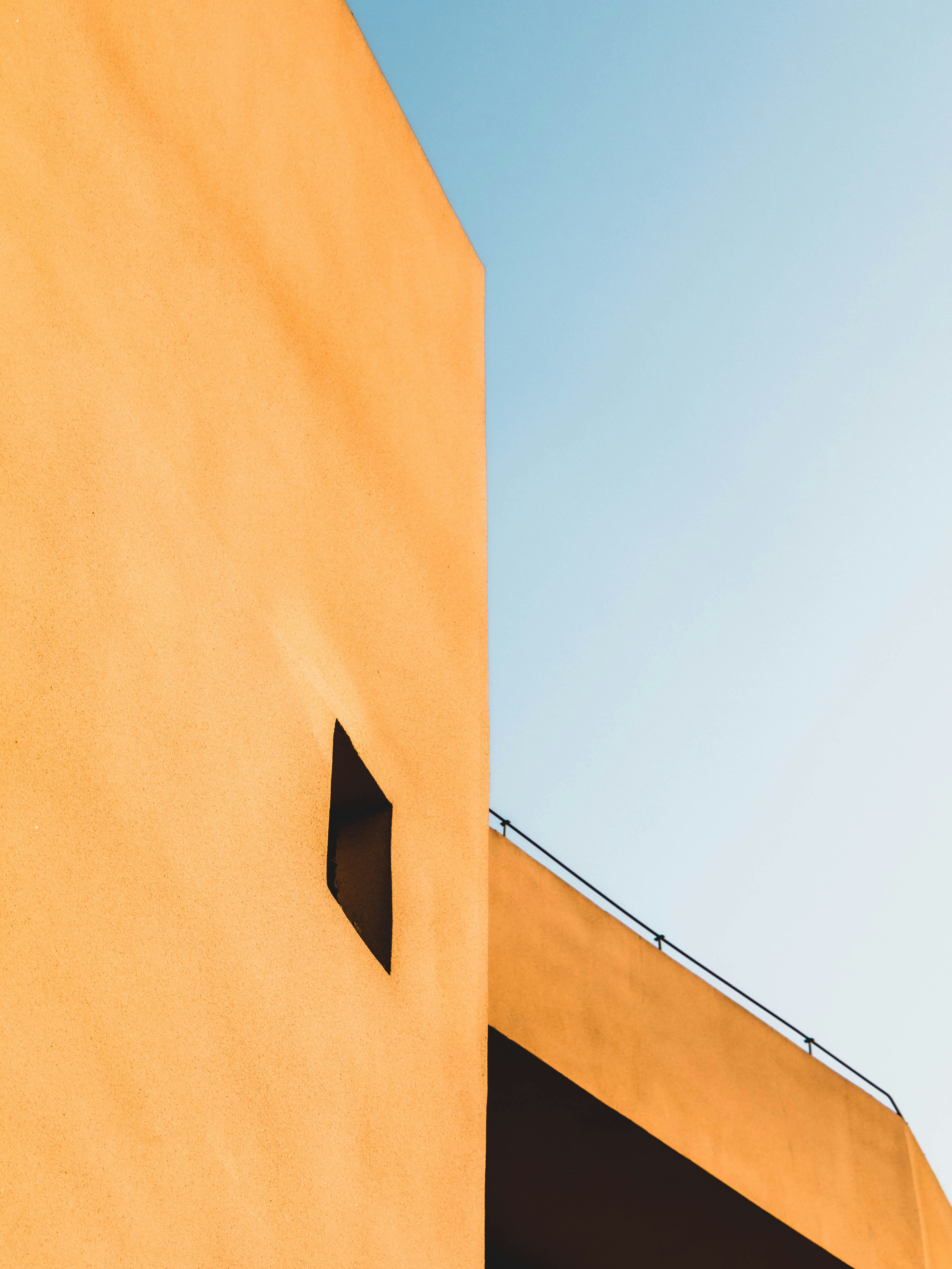 orange concrete building under blue sky during daytime