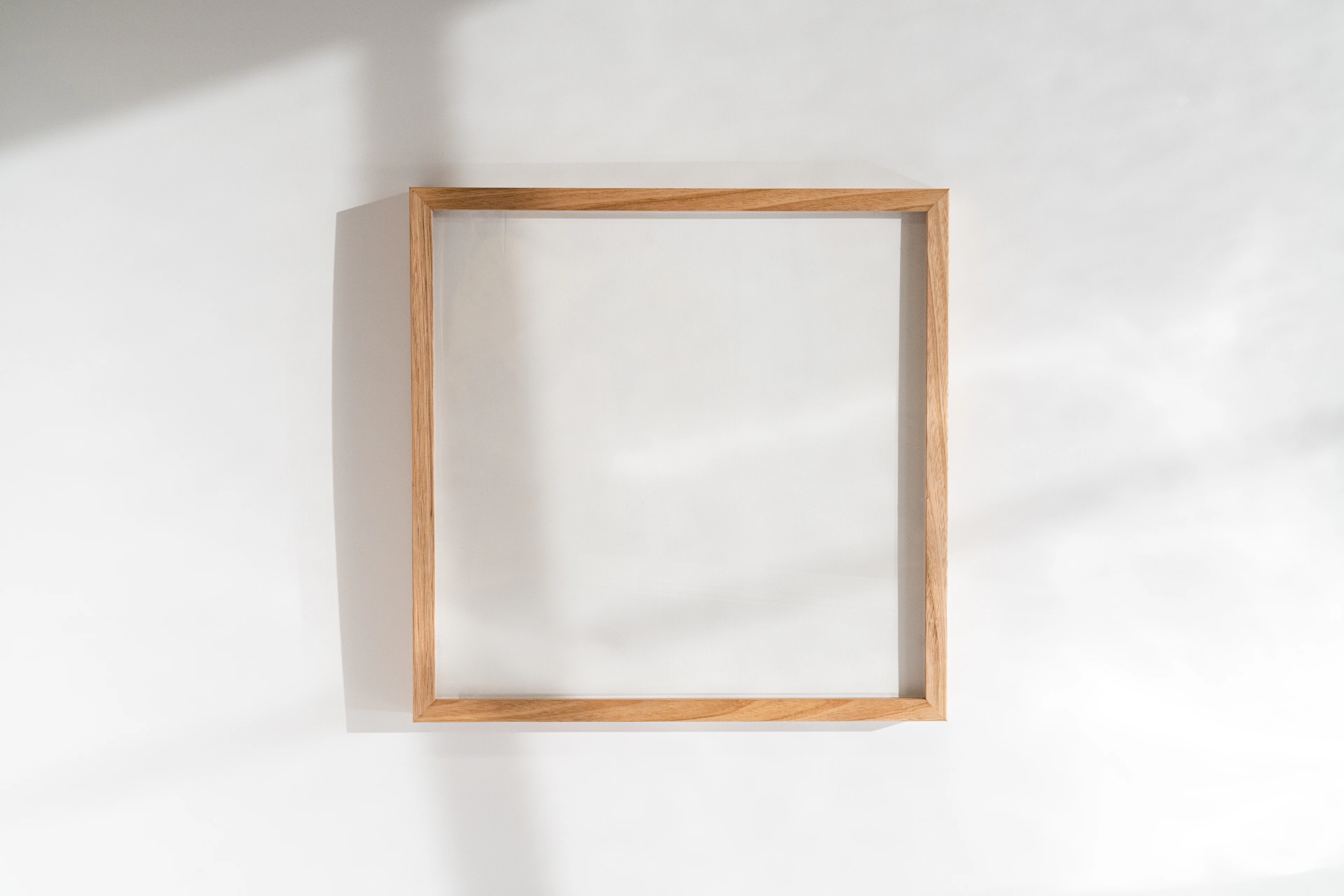Square wooden frame on a wall