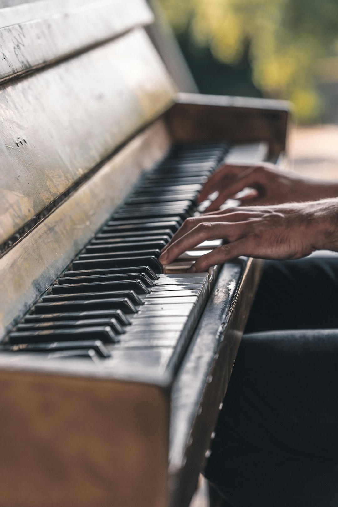 person playing piano during daytime